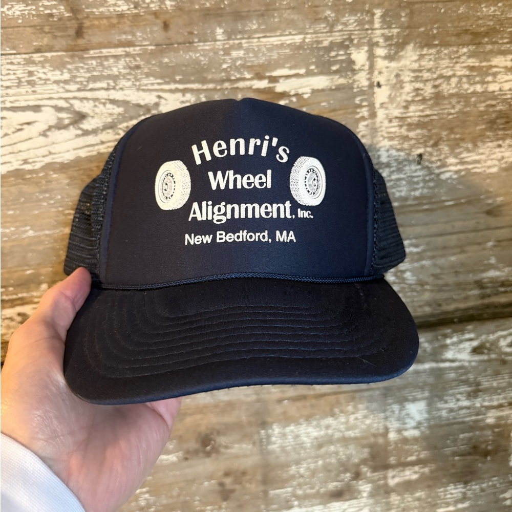 Vintage trucker hat  “Henris wheel alignment“ navy blue with white lettering.